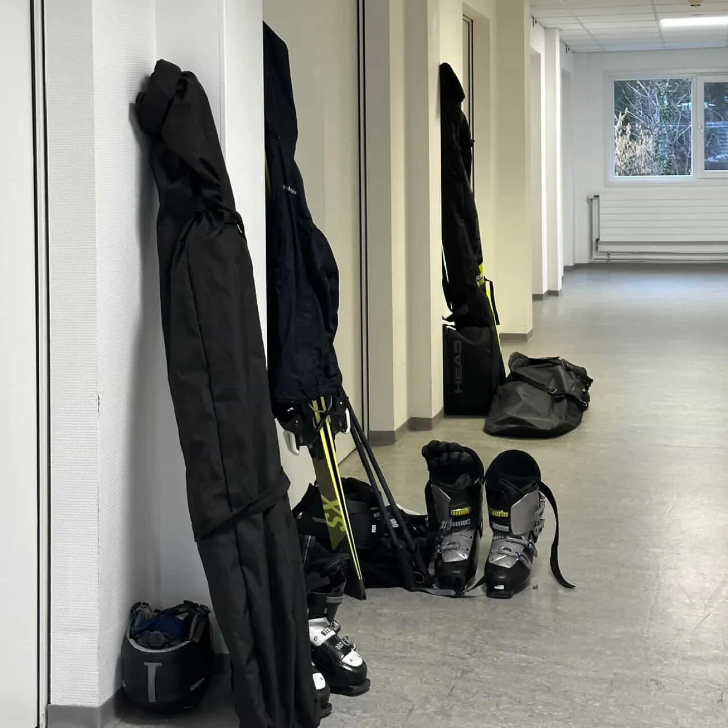 Ski equipment leaning against a hallway wall at the University of Liechtenstein.