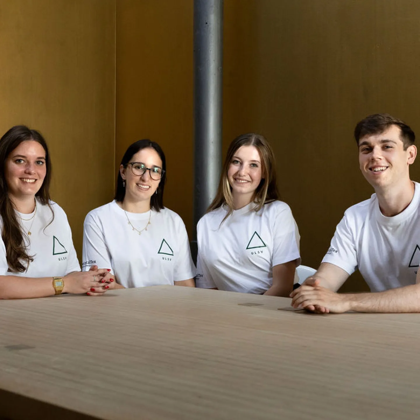 Four members of the ULSV student representation sit together at a table.