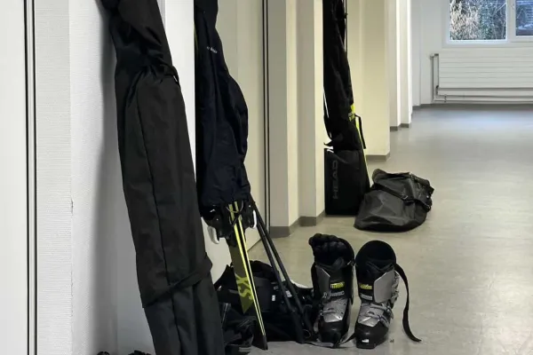 Ski equipment leaning against a hallway wall at the University of Liechtenstein.