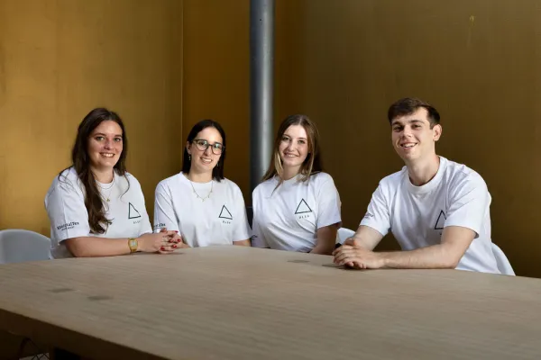 Four members of the ULSV student representation sit together at a table.